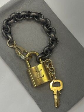 Repurposed authentic Louis Vuitton locket bracelet. Rolo chain matte gunmetal
